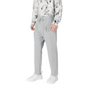Gray drawstring trousers displayed in a fashion retail setting highlighting comfort and style