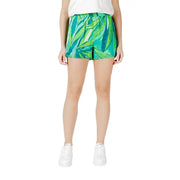 Green floral viscose shorts for women with vibrant green and teal tropical leaf pattern and relaxed high-waisted fit with pockets
