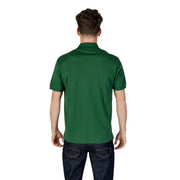 Green Lacoste polo shirt featuring a solid color short sleeves classic collar and neatly stitched seams