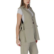 Beige blazer vest with single button closure and matching tie-back detail in green sleeveless v-neck gilet by byoung