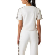 Guess active women beige cotton round neck t-shirt with white cropped top featuring black patterned trim on sleeves and side seam