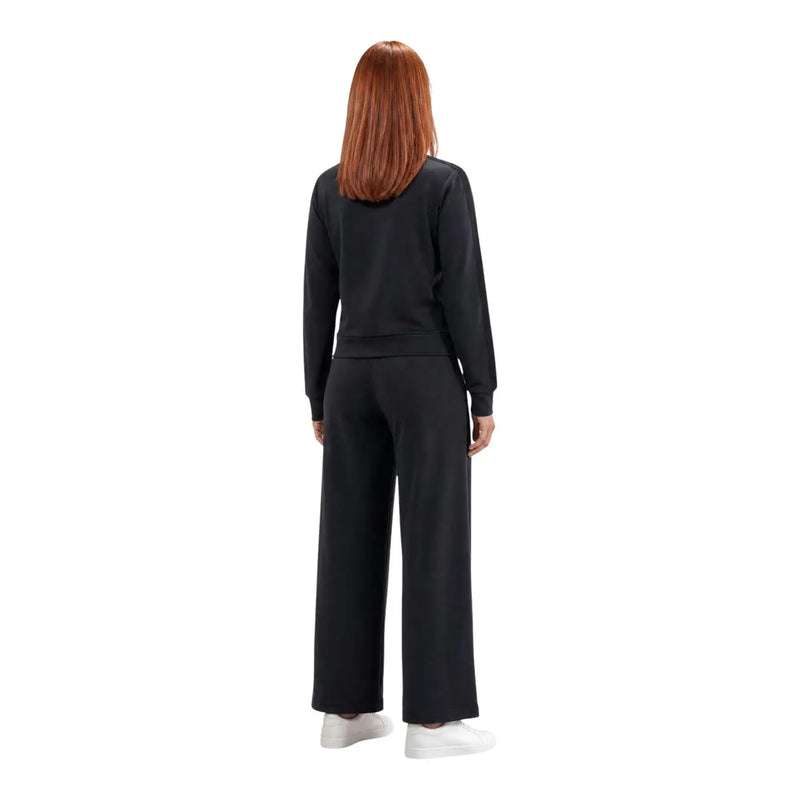 Black guess active women lyra straight pant trousers paired with relaxed fit long-sleeved sweatshirt with ribbed cuffs