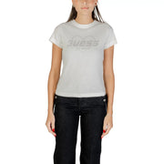 Woman wearing Guess Active white short-sleeved T-shirt with GUESS logo inside heart design