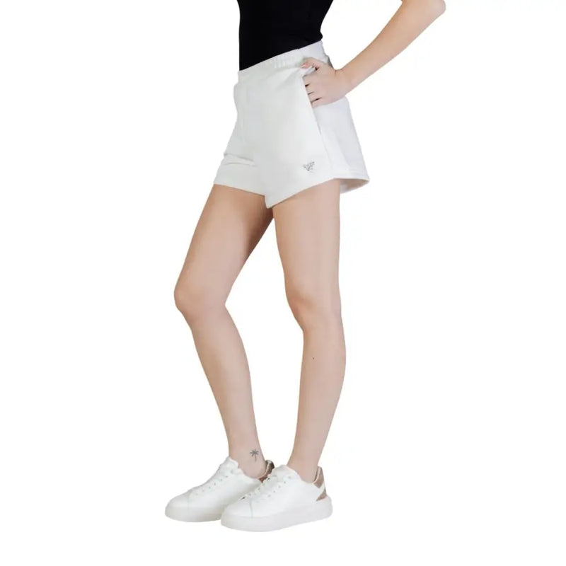 Guess active women white cotton polyester athletic shorts with a subtle logo on the side seam