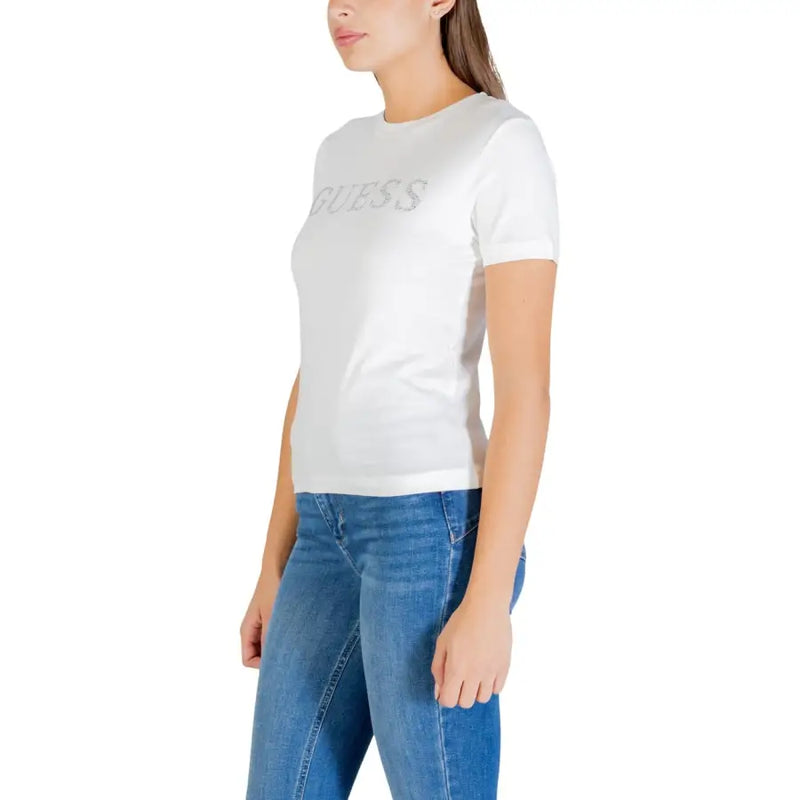 White Guess active women cotton t-shirt with round neck short sleeves and silver glitter lettering across the chest