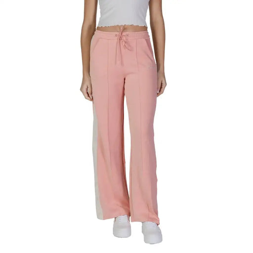 Guess Active women’s pink wide-leg sweatpants with drawstring waistband front pockets and subtle side stripes