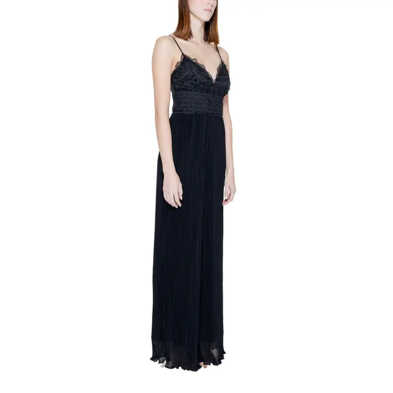 Guess black jumpsuit with sweetheart neckline featuring black lace and pleated maxi skirt with delicate spaghetti straps