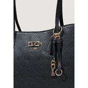 Black Guess polyurethane tote bag with embossed logo pattern and metallic hardware accents featuring multiple pockets