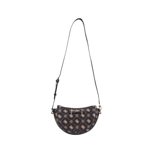 Black Guess shoulder bag with half-moon shape, gold-toned logo pattern, and adjustable matching strap in brown print