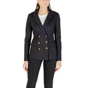 Woman wearing Guess Long Black V Neck Blazer with gold buttons for fall winter fashion