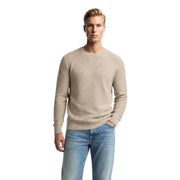 Beige ribbed knit crewneck sweater combining comfort and style in a versatile menswear essential