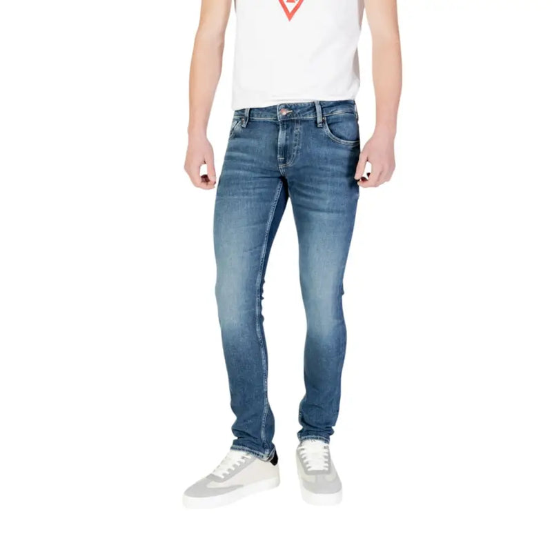 Guess men blue slim fit denim jeans with faded wash classic stitching and belt loops from spring summer collection