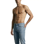 Light-wash denim jeans by Guess men featuring a classic five-pocket design and straight-leg cut with cotton stretch
