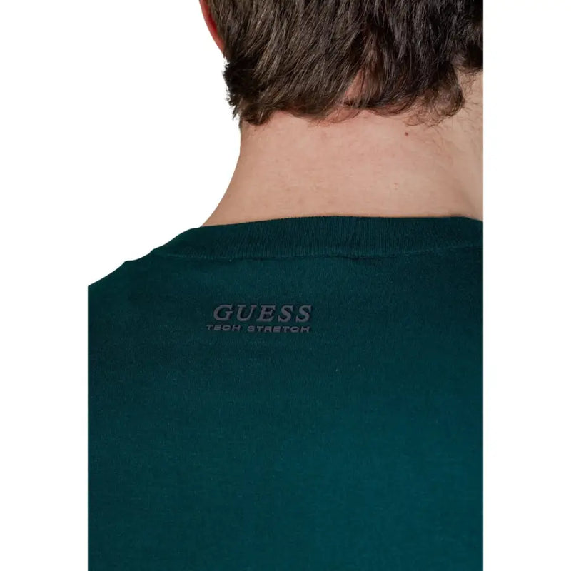 Dark green guess men knitwear tech stretch t-shirt with a subtle embroidered logo at the neckline in viscose blend