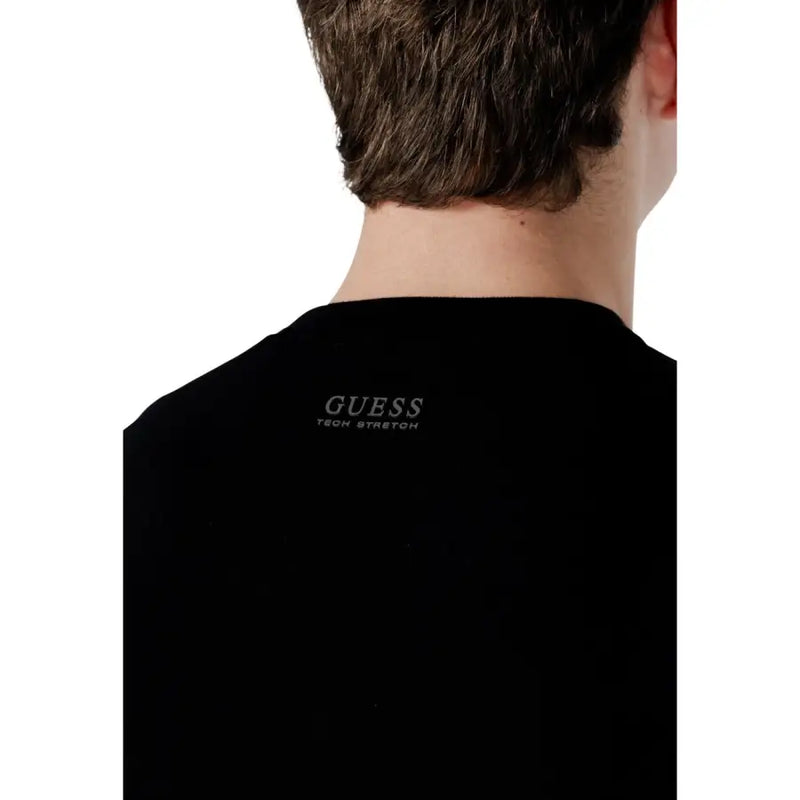 Black Guess Men knitwear Kadir tech long sleeve sweater with stretch fabric and silver embroidery at the neckline