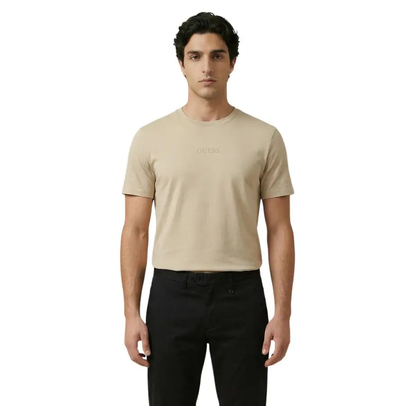 Beige Guess men t-shirt made of soft fabric featuring a subtle embroidered logo on the chest for casual wear