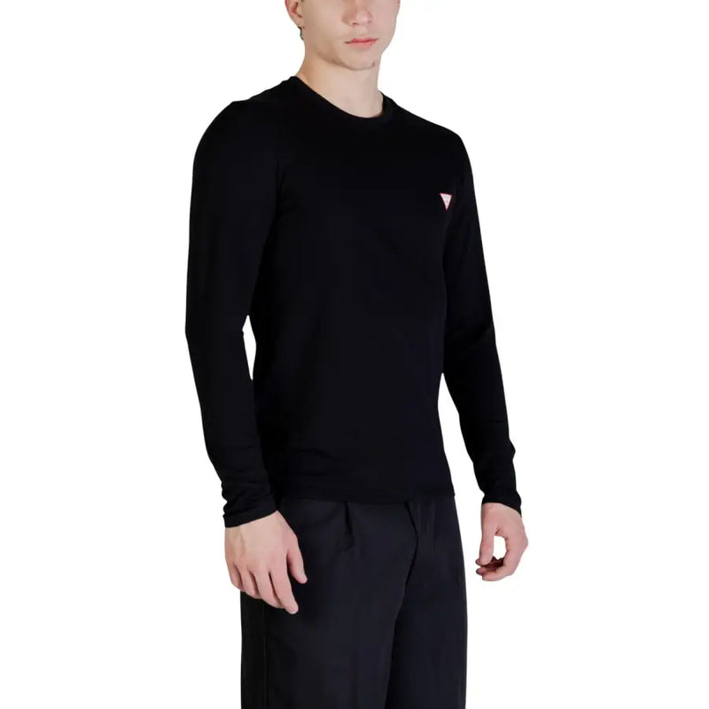 Guess men black long-sleeved crewneck sweater featuring a small pink triangular logo on the left chest