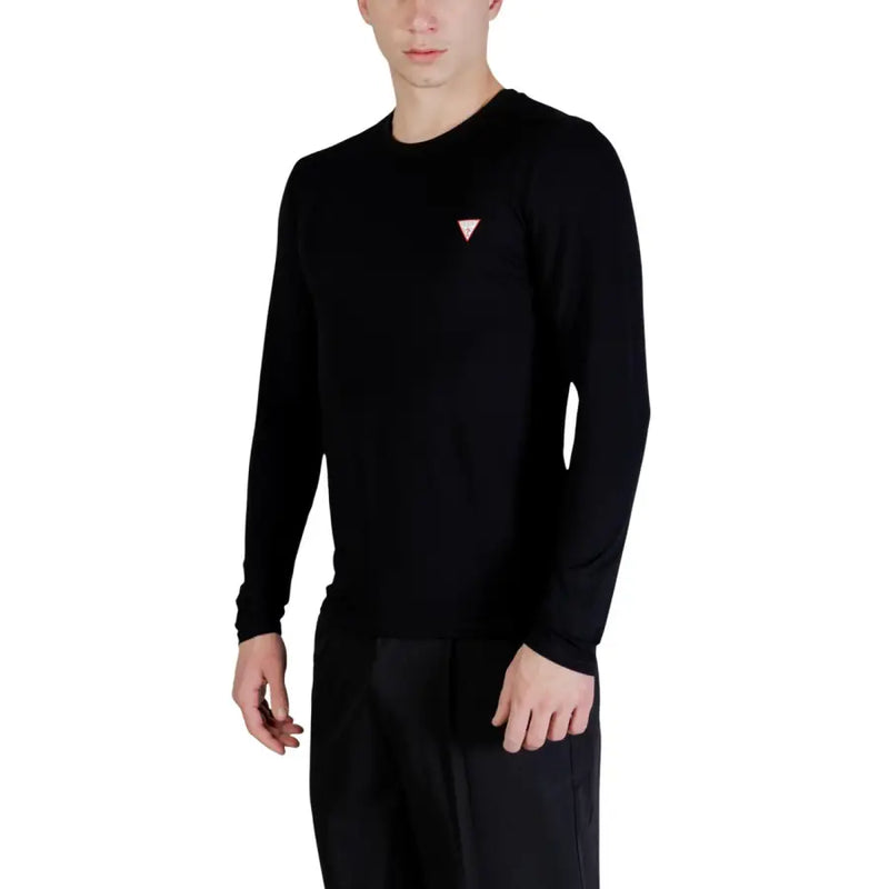 Guess men t-shirt black long-sleeved crewneck sweater with small pink triangular logo on the left chest