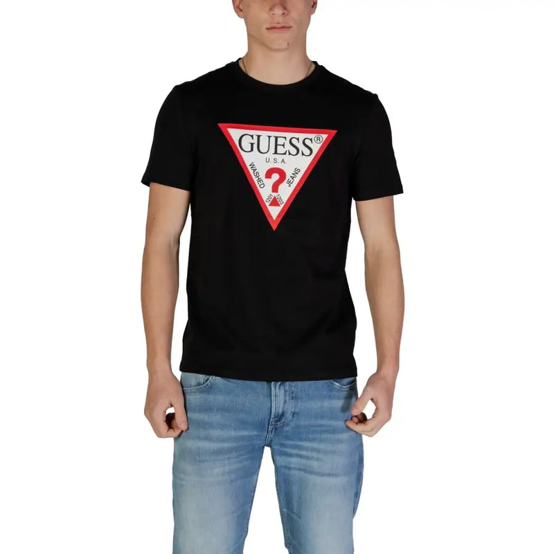 Black Guess men t-shirt featuring bold red and white triangular logo with brand name and washed jeans text