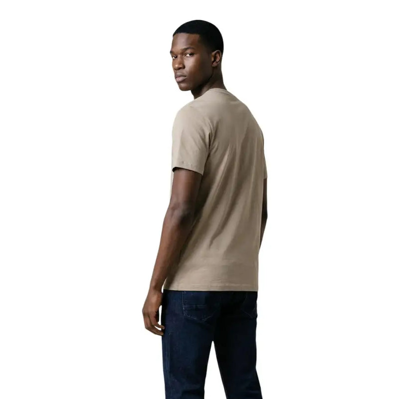Beige short-sleeved crew neck t-shirt for men by Guess featuring comfortable cotton fabric and casual style