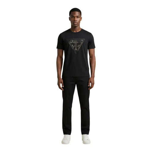 Black Guess men t-shirt featuring a silver triangular logo with brand name and question mark design on front