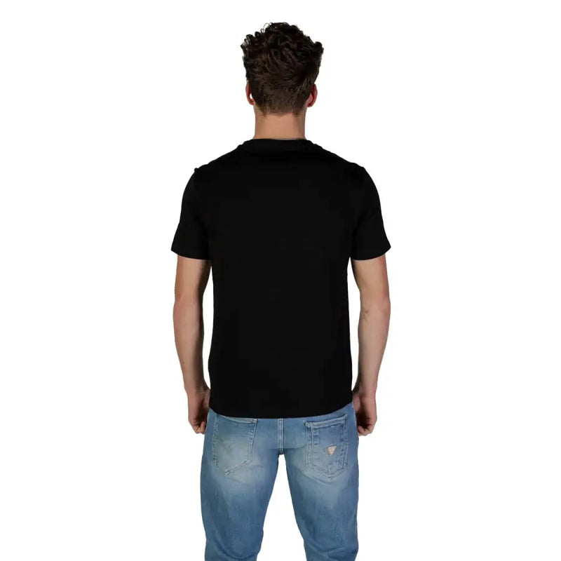 Guess men t-shirt black short-sleeved crew neck made of soft cotton worn by a model