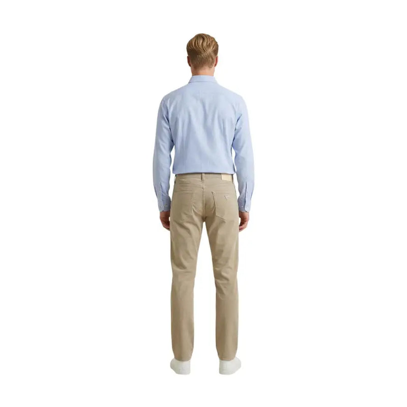 Back view of guess men trousers beige cotton blend angels slim fit chino trousers with subtle texture and logo patch