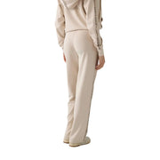 Beige guess women sweatpants with black vertical text stripe modal blend fabric casual trousers front view