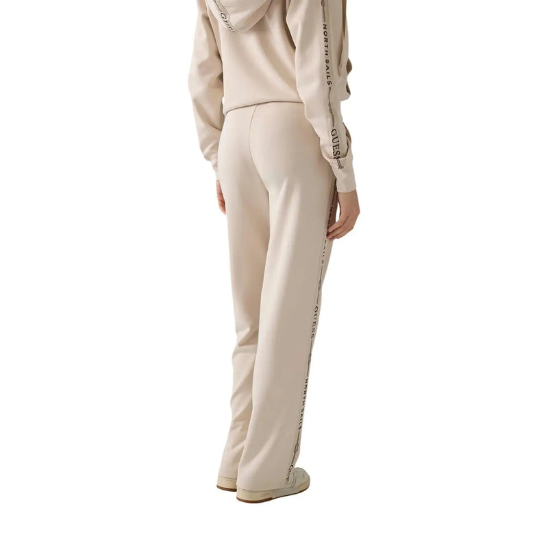 Beige guess women sweatpants with black vertical text stripe modal blend fabric casual trousers front view
