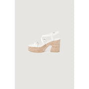 Guess women beige platform sandals with block heel featuring thin straps and cork sole and heel viewed from the back