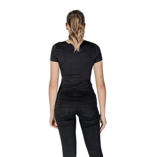 Guess women black cotton rhinestone round neck t shirt with short sleeves and subtle back seam detail shown from the back