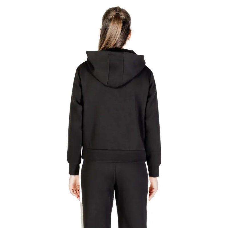 Guess women black hooded zip sweatshirt made of cotton polyester with ribbed cuffs and hem shown from the back side