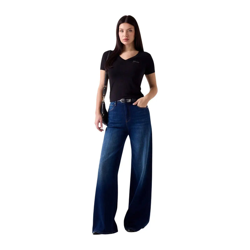 Dark blue wide-leg denim jeans with straight cut and faded wash paired with guess women black modal lycra v neck t shirt