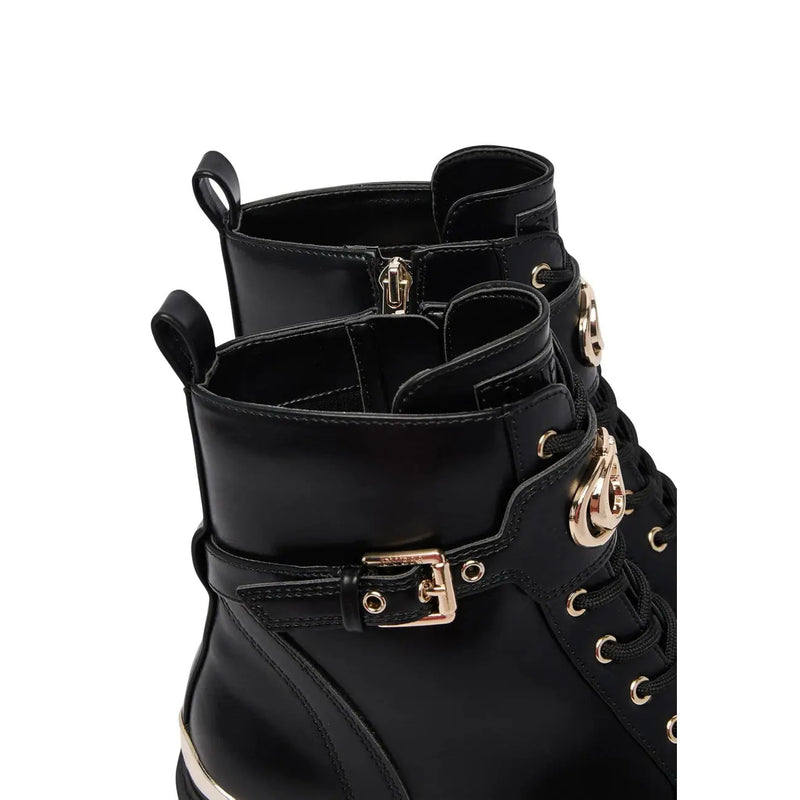Guess women black polyurethane lace up ankle combat boot with patent leather, gold-tone metal accents, and buckle detail