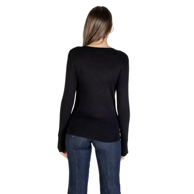 Women’s black long-sleeve knitwear with asymmetrical hem and rhinestone details