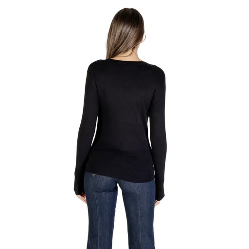 Women’s black long-sleeve knitwear with asymmetrical hem and rhinestone details