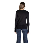 Black long-sleeved knit top with simple crew neckline made from viscose by Guess women knitwear collection