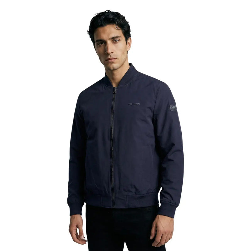 Navy blue Guess women polyester bomber jacket with subtle embroidered branding and zip pockets in a sleek design