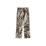 Guess women brown viscose wide-leg trousers in black and cream with bold abstract leaf pattern from spring summer collection