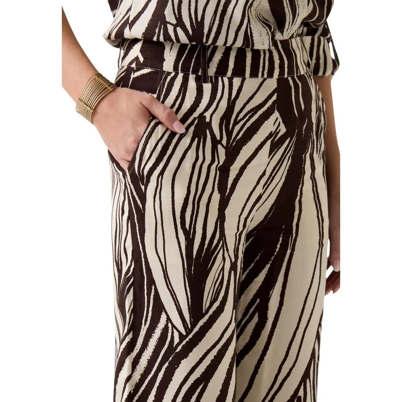 Guess women brown viscose high-waisted trousers with cream zebra stripes and sleek flowing fabric spring summer collection
