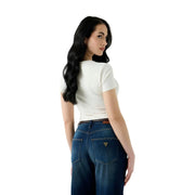 A woman wearing a white cotton Guess women snake triangle round neck t shirt shown from the back side