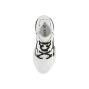 White and black Guess women leather sneakers with bold chunky design and geometric pattern on the side