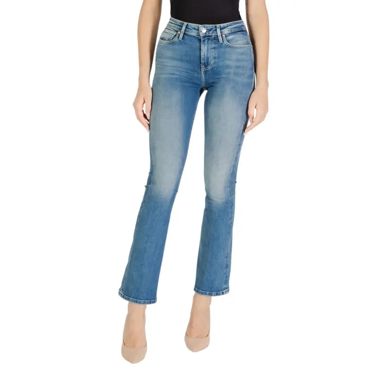 Women’s light wash blue denim flare jeans from Guess with zip and button closure