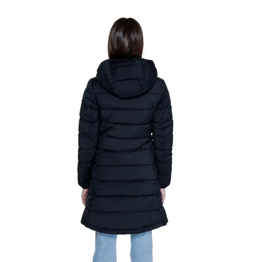 Woman wearing Guess Women Long Black Puffer Coat with Hood and Turtleneck