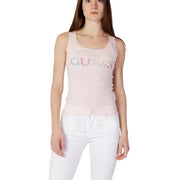 A light pink Guess women tank top with a sparkling multi-colored rhinestone logo across the chest