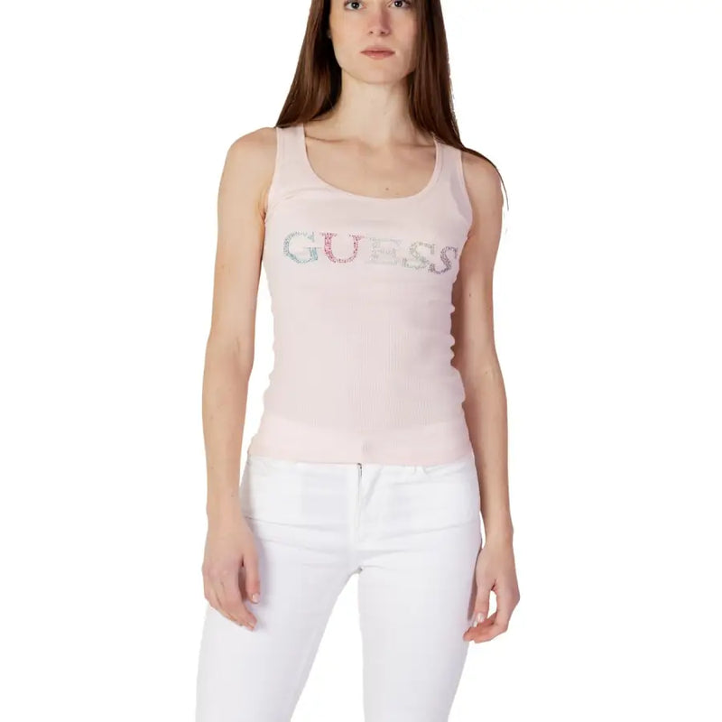 A light pink Guess women tank top with a sparkling multi-colored rhinestone logo across the chest