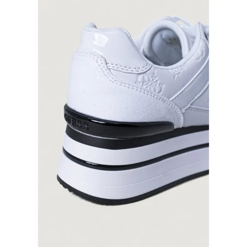 White guess women sneakers with laces featuring a glossy black heel strap and layered sole shown from the back side