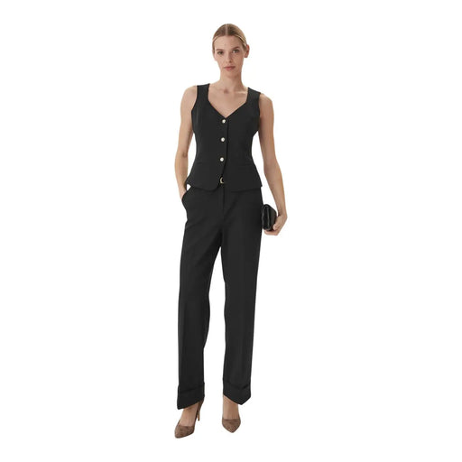 Black sleeveless button-up vest with v-neckline and tailored fit paired with guess women structured crepe belted trousers