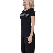 Black guess women t-shirt in cotton lycra with sparkling silver lettering and matching logo on pants lower left leg