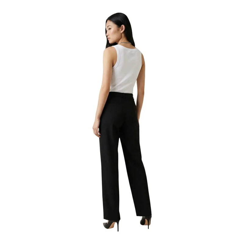 Black high-waisted wide-leg trousers paired with guess women white round neck sleeveless cotton tank top